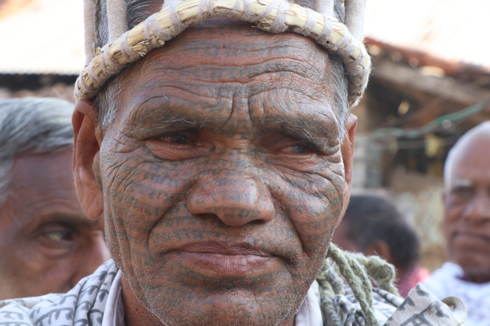 A ramnami man with ram-ram godna on his face