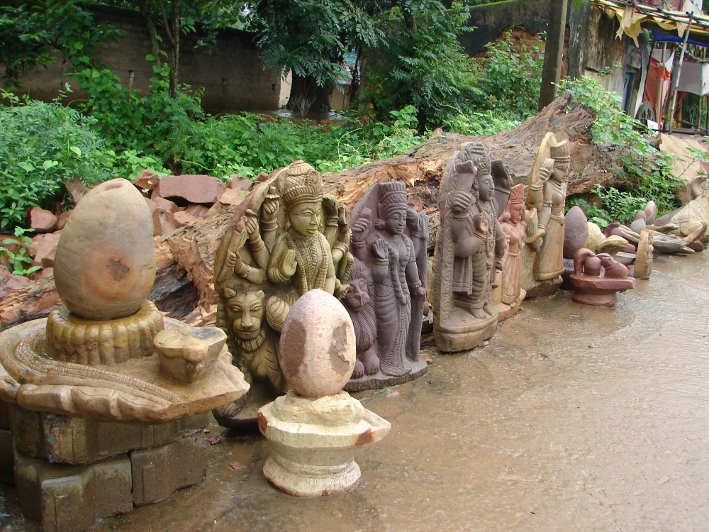 A row of finished stone sculptures