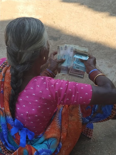 Woman with her share of money.