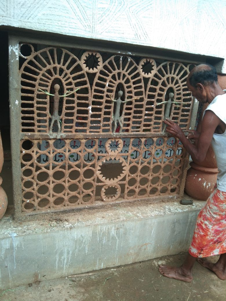 Pandit Ram working on a designer separator inside the house