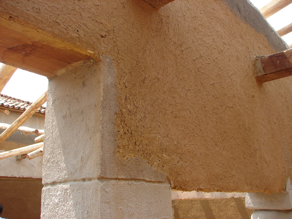 Applying moist clay over cemented-pukka surface