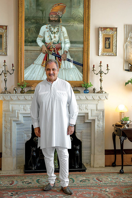 Maharaja Gaj Singh II standing in front of the portrait of Maharaja Takhat Singh at Umaid Bhawan Palace (Photo courtesy: Mehrangarh Fort Museum via Laura Marsolek, published with permission)