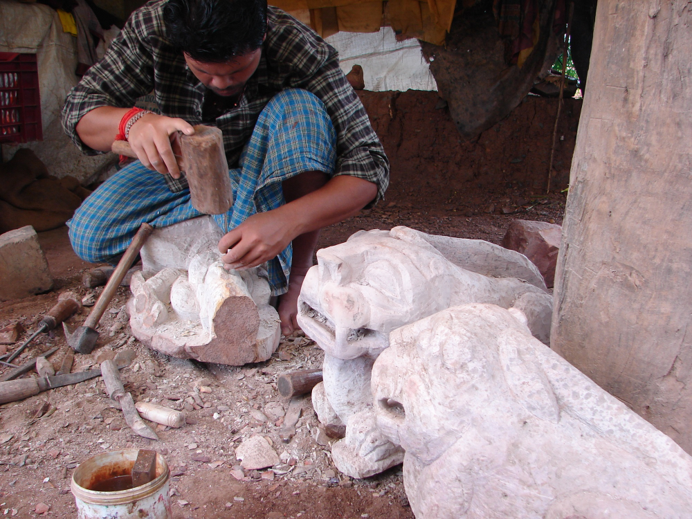 A sculptor working on his sculpture