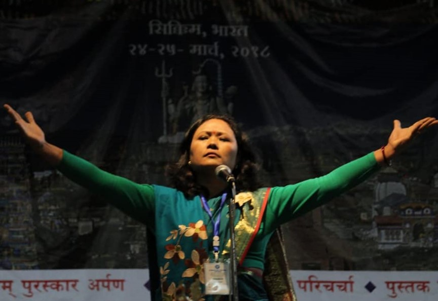 Fig. 6: Pavitra Lama performing her poem, ‘Harkamaya’ at the International Nepali Women’s Literary Meet, Tadong, Gangtok, Sikkim on April 6, 2018 (Courtesy: Nimesh Subba)