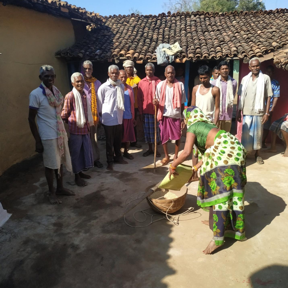 Group of older men collecting their share of offering.