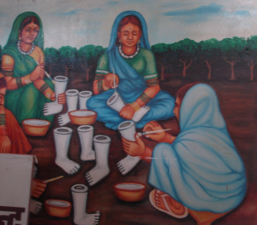 A poster of women involved in clay work