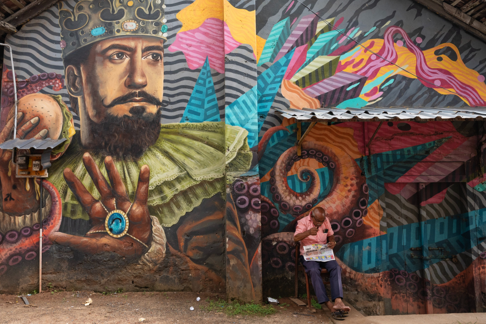 A warehouse covered in wall art featuring a Hollywood star