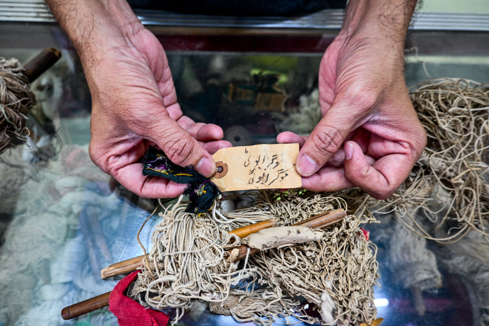 Imran Qureshi shows a old naqshas. (Picture Credits: Anil Purohit)