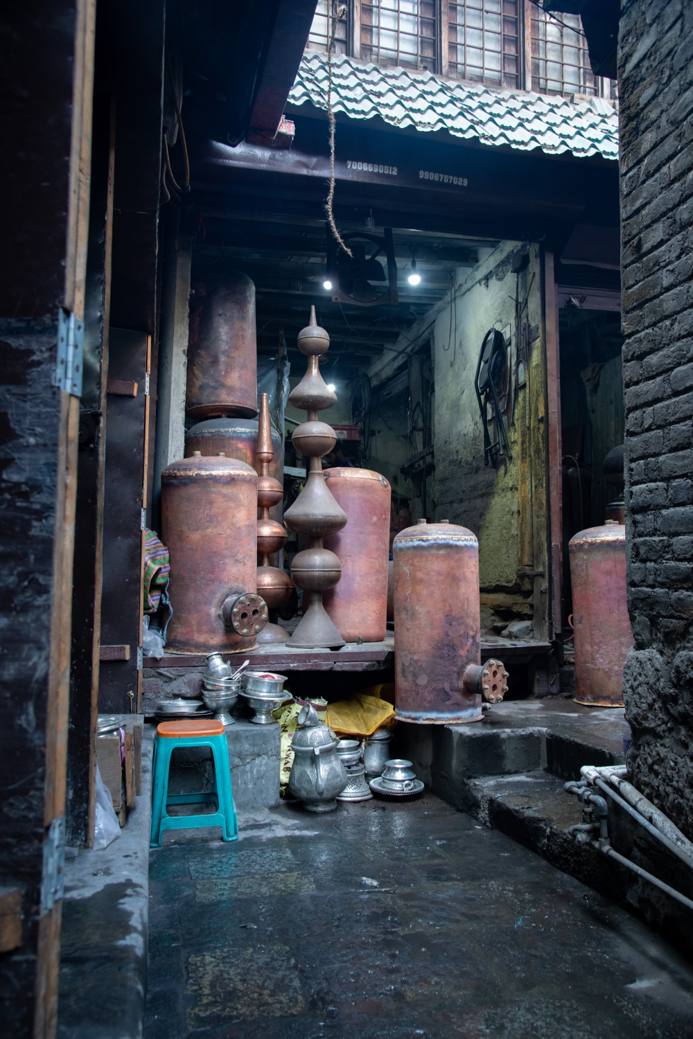 Taan kaam, an age-old copper engraving craft, transforms vessels and décor with floral and calligraphic designs, etched by skilled artisans.