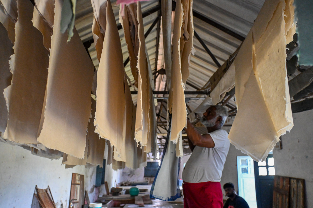 Paper sheets are hung out to dry after using the press machine. (Picture Credits: Anil Purohit)