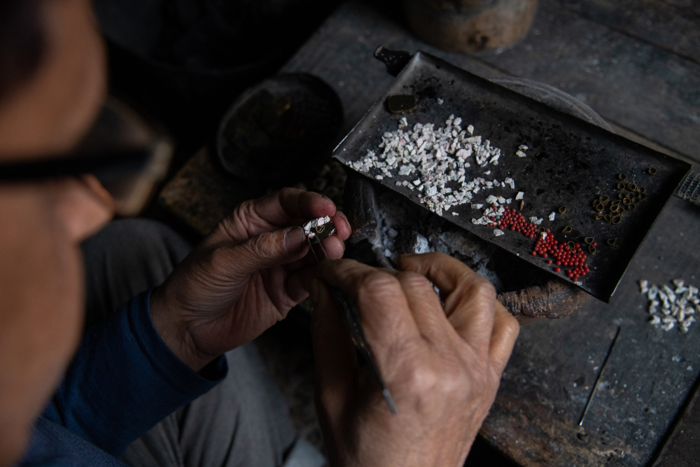 Turquoise stones being skillfully crafted into intricate jewelry by the artisan. (Picture Credits: Syed Muneeb Masoodi)