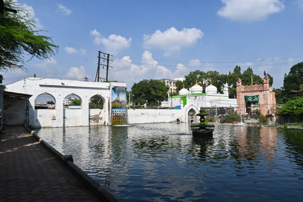 View of the pool in the Panchakki complex. In the distance is Mahmud Darwaza and the domed Jamil Baig masjid. (Picture Credits: Anil Purohit)