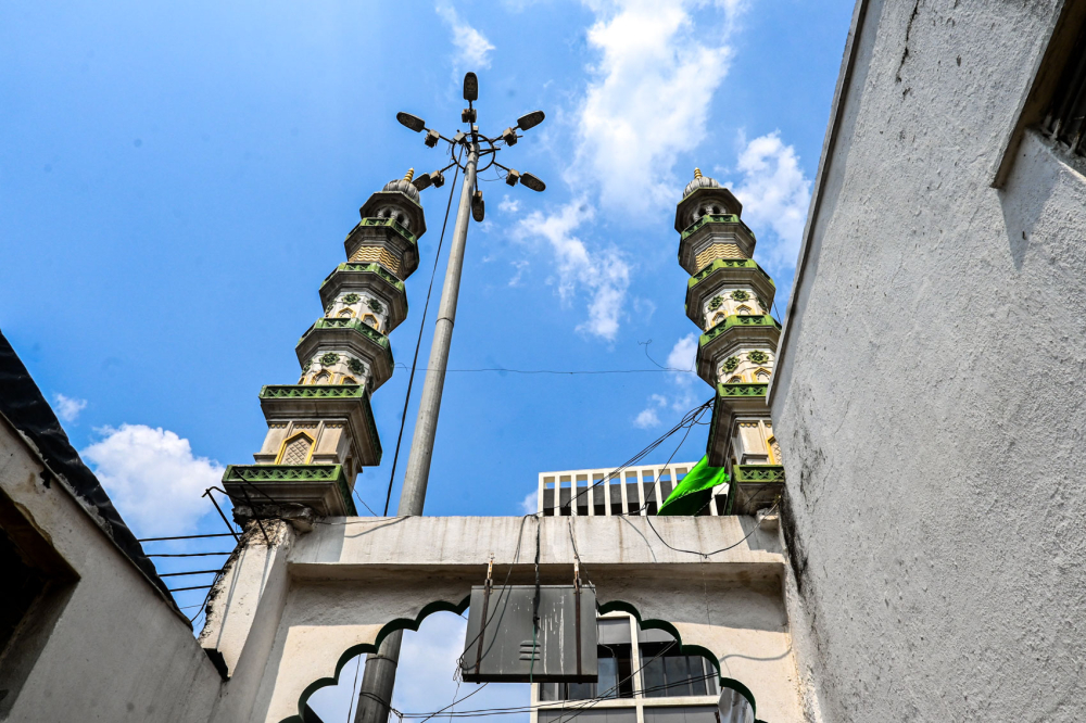 Minarets rise over the entrance to the Shah Ganj mosque. (Picture Credits: Anil Purohit)