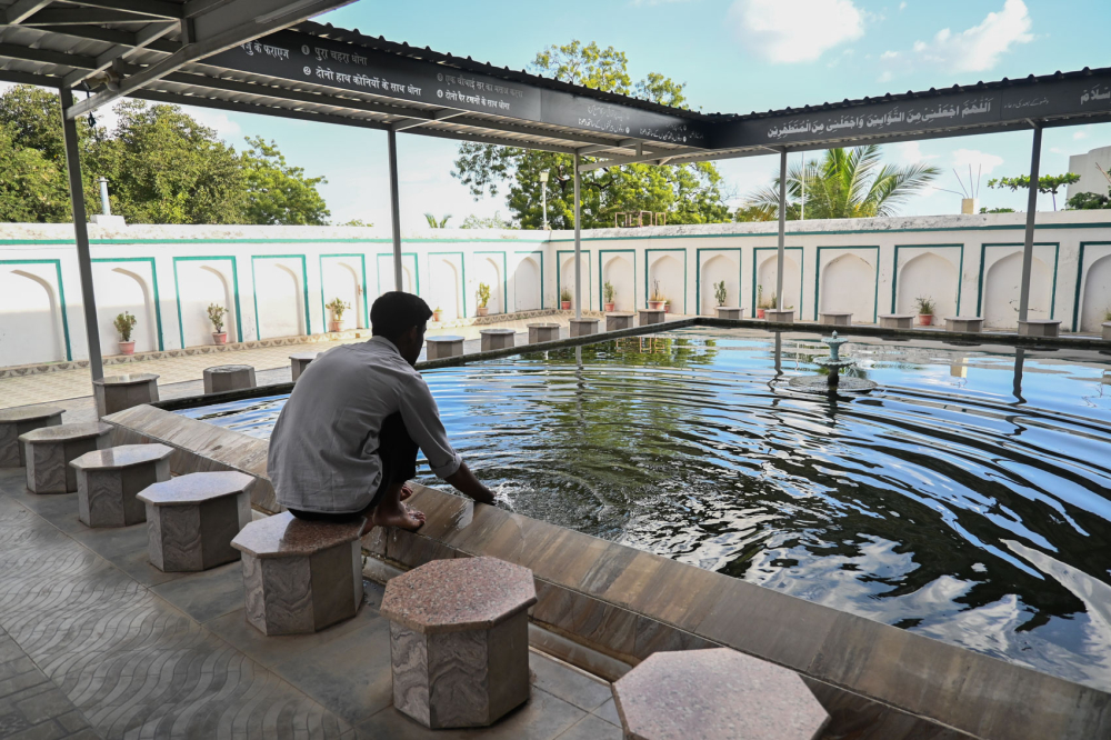 Worshipper washes himself before prayer at Shahi Mosque. (Picture Credits: Anil Purohit)