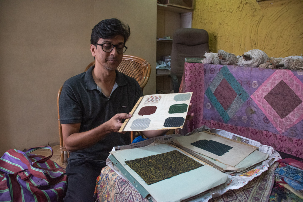  Imran Qureshi shows a collection of designs used in Himroo Factory. (Picture Credits: Anil Purohit)