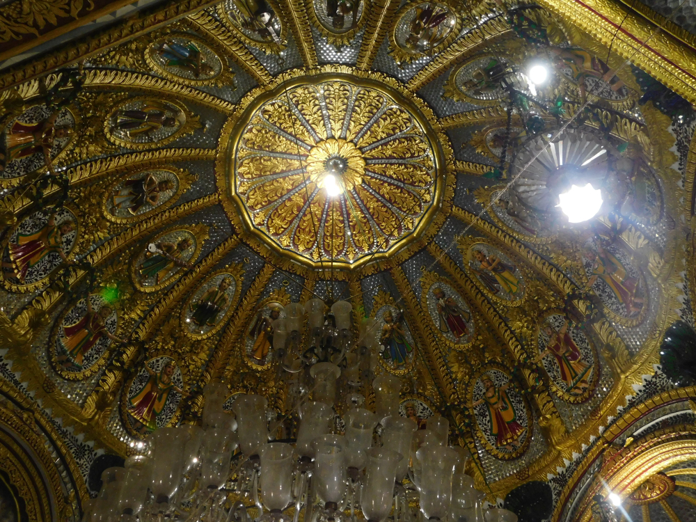Fig 1: The apex of the dome’s interior has a lotus-like motif and the ridges radiate out of this centrepiece dividing the dome into 16 equal sections. Each section houses a standing male figure on top holding various musical instruments and standing female figure at the bottom with outstretched arms holding garland-like objects (Courtesy: Sritama Halder)