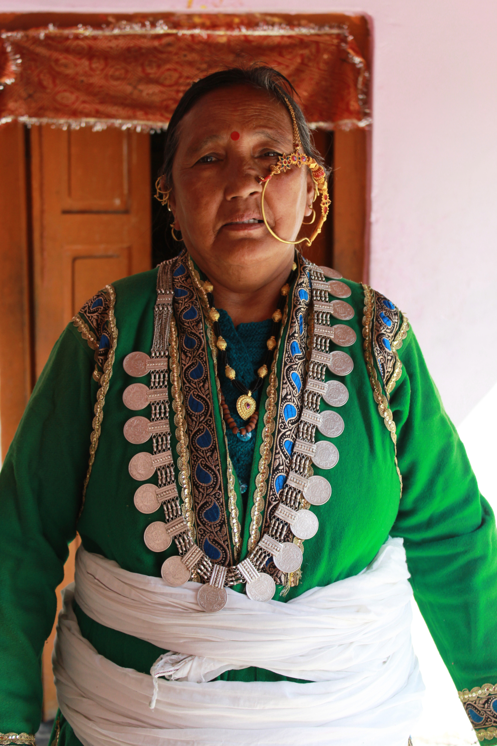 Fig 9: A woman wearing a kolak, along with the ornaments, nath and kanthi