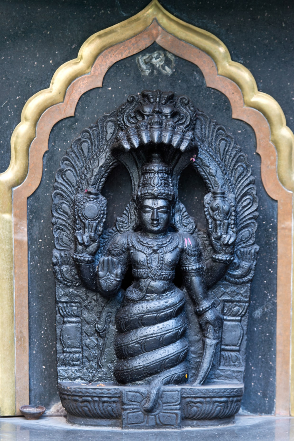 Fig 1 Four-armed Patañjali holding a sword; Ramamani Iyengar Memorial Yoga Institute, Pune. Photograph courtesy of Dominik Ketz. From ‘Nāga, Siddha and Sage: Visions of Patañjali as an Authority on Yoga’ by Gudruhn Bühnemann in Yoga in Transformation. Historical and Contemporary Perspectives, edited by K. Baier, Ph. A. Maas and K. Preisendanz. Vienna: Vienna University Press, 2018: 577–622.  p. 613. https://doi.org/10.14220/9783737008624.575. Copyright: Creative Commons 4.0 ShareAlike.