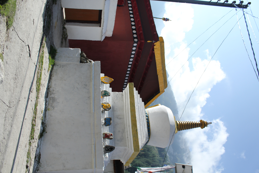 Fig 2: The Buddhist Stupa with Mani stones and the temple in the background. Every morning people in the village circumambulate around the temple and the stupa