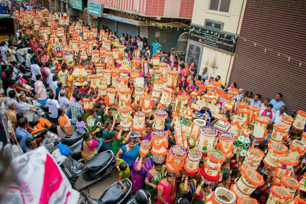 Fig. 5.Women headed towards the Dharmaraya Swamy temple with their ornamental pots for the aarti deepotsava. It is performed on the sixth day of the festival to invite Goddess Adi Shakti into people’s homes (Photo courtesy: Prashanth B Vepuri, Revival Heritage Hub) 