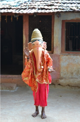 Fig. 1: A young boy dressed as Lord Ganesha for a khele performance at a wedding (Courtesy: Sonam Ambe).