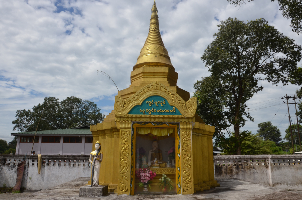 Fig. 3: Vasundhara, with her flowing hair, is placed in front of the Buddha’s shrine in Chongkham Buddha Vihar, Chongkham, Arunachal Pradesh. Vasundhara, the earth goddess, is sometimes placed as a guardian deity in front of the Buddha’s shrine. In the legend associated to her, on the Buddha’s call she caused a flood by wringing her hair to drown Mara’s army
