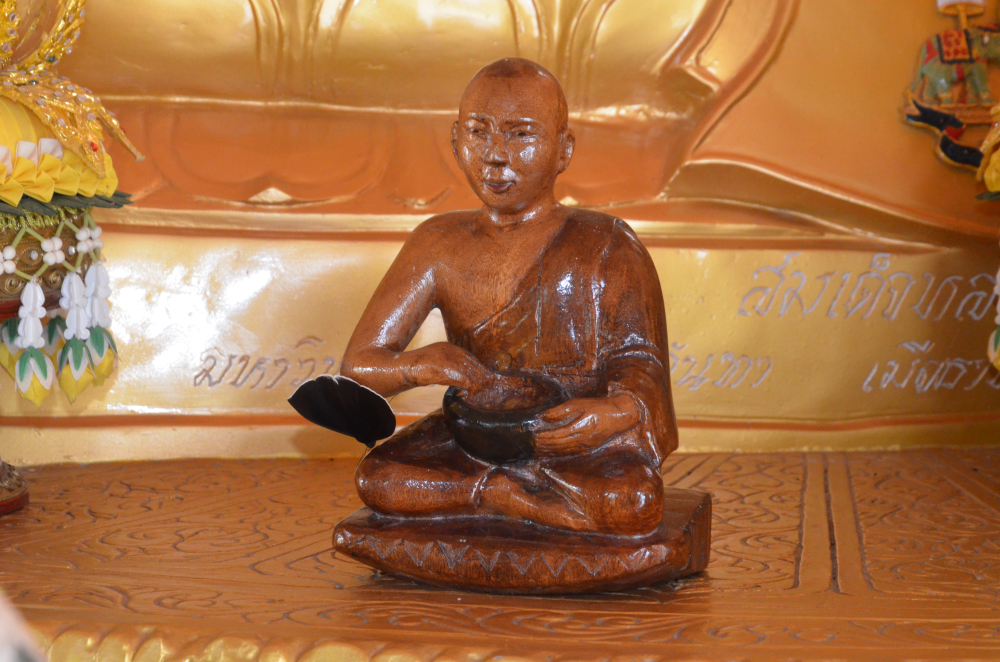 Fig. 4: A wooden image of Upagupta in Kongmu Kham (golden pagoda monastery), Tengapani, Arunachal Pradesh. In most of the Theravada monasteries of Arunachal Pradesh, small idols of Upagupta are placed near the Buddha statues. Upagupta is regarded as a powerful monk who defeated the demon, Mara. He is believed to be alive and residing in the serpent kingdom under water