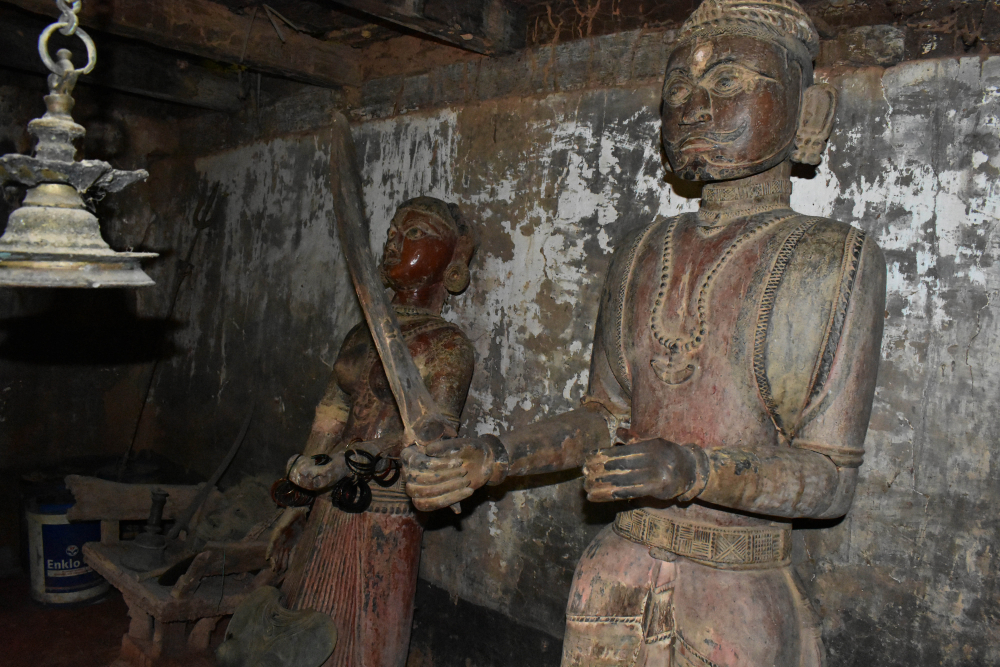 Fig 4: The daivakone at Deroddu Guttu, Nitte is uncommon because it has wooden life-size statues that are over a hundred years old. All other guttumanes have smaller, portable metal statues 