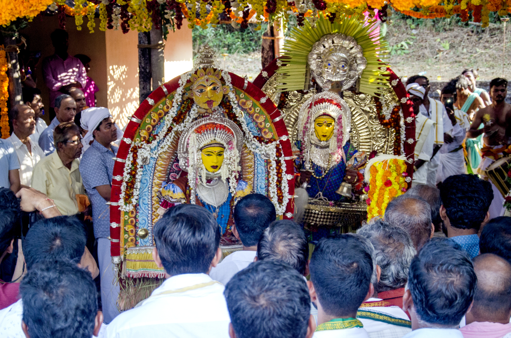 Fig 5: Bhootakola ceremony. The paatris wear crowns, masks, headgears and a large back support known as ani. The metal parts of the entire attire consisting the headgear, jewellery and sword are preserved at the daivakone of the guttumanes