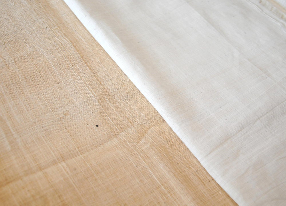 Patnulu fabrics woven with yerra patti (left) and konda patti (right). Note the slight creamish tint of the yerra patti which is the natural color of the cotton. Yerra patti is used mostly for coarser varieties (Courtesy: Samyuktha Gorrepati)