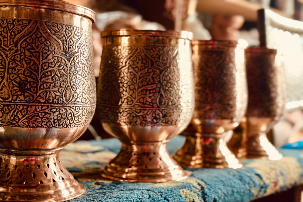 Copper Vases with traditional taan kaam engravings. (Picture Credits: Taha Mughal)