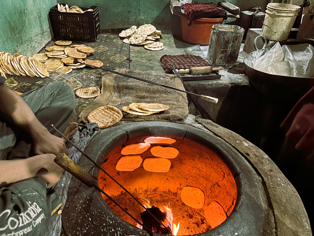 Metal rods and girde in the glowing tandoor. (Picture Credits: Taha Mughal)