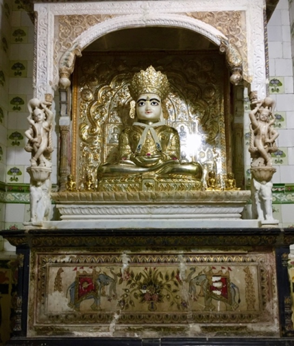 Fig. 1: Altarpiece of the deity of Neminathji made of white marble gilded with gold and silver plates at Shri Neminathji Temple, Azimganj, Murshidabad. (Courtesy: Mrinalini Sil)