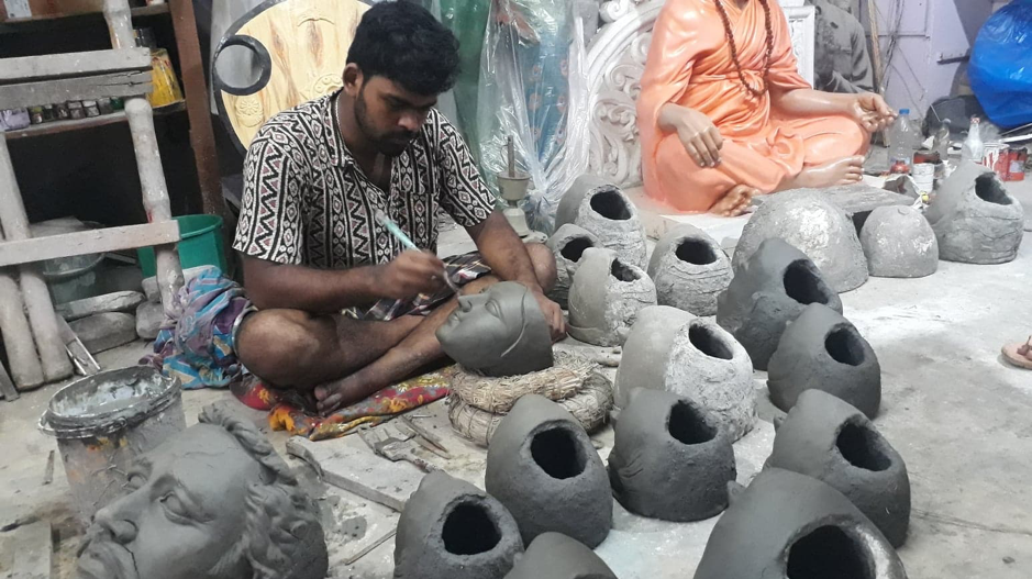 Fig 6: An artist makes faces of idols from moulds. (Courtesy: Aaheli Sen)