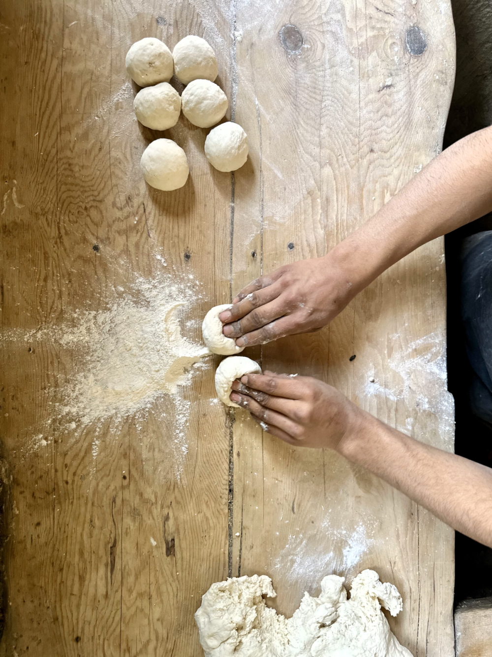 Wasta rolling dough balls. (Picture Credits: Taha Mughal)