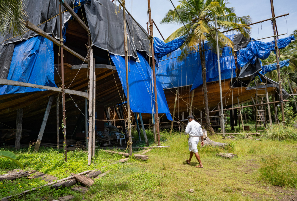 The uru under construction, covered with blue tarpaulin sheets