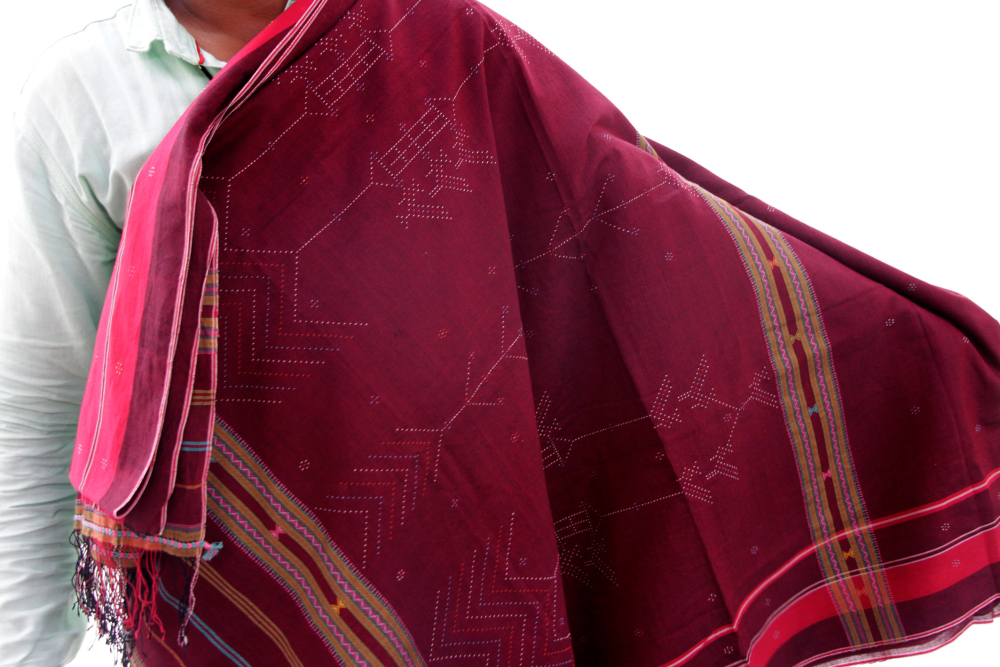 Suresh Vankar displays a detailed cotton saree woven by him.