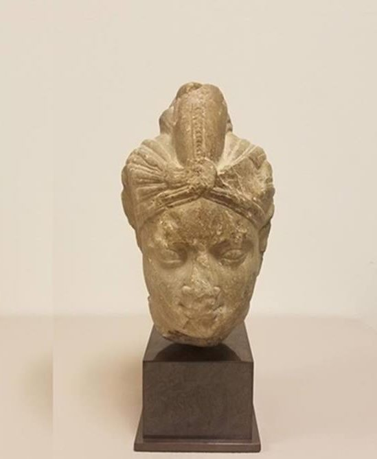 the head of an indian deity, met indian antiques, met statues retured