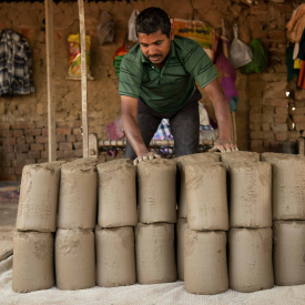 The pug mill produces compact clay which are cut off in the shape of Shivling and stacked. These moulds are thrown on the chaak to give shape to pottery items (Courtesy: Jai Thakur)
