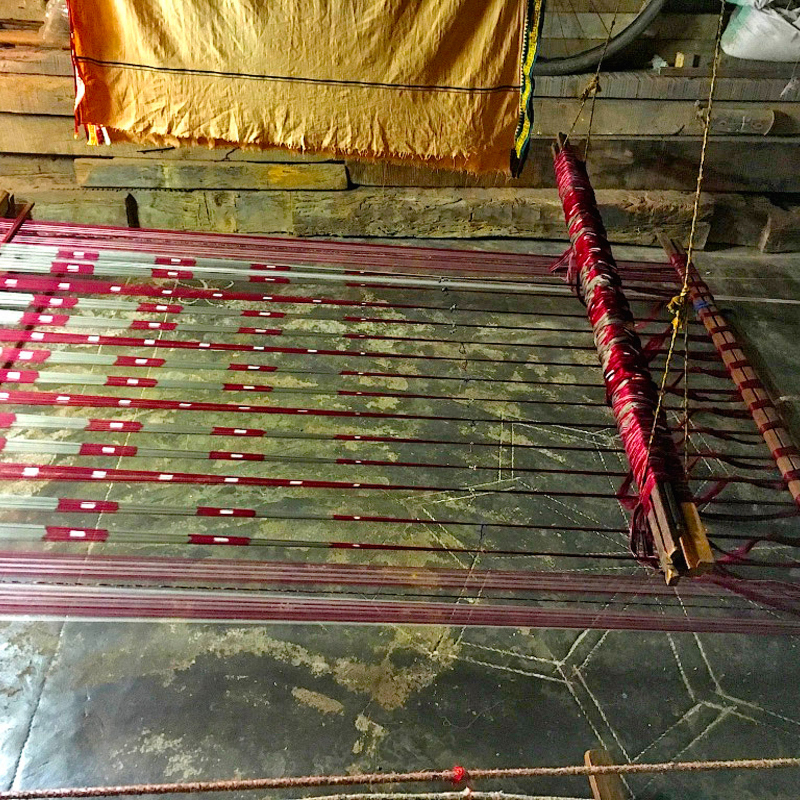 Warp Threads: The warp or vertical threads in the loom which crisscross with the weft threads to form the Swan and Lotus motif
