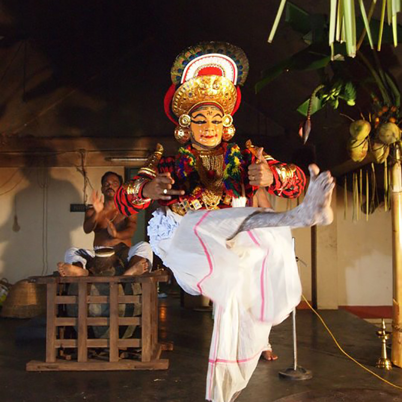 Kutiyattam actor performs while the mizhavu player plays at the back 