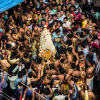 The Karaga priest protected by the veerakumaras while devotees try to seek blessings during the procession (Courtesy: PEEVEE)