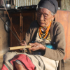 A Ruangmei elder in Rianglong village, Tamenglong, with her nrah (violin/harp). She is 99 years old, which makes her one of the oldest person in her village. Traditionally, women did not learn to play nrah; even though it was not restricted, it was seen as a role not fit for a woman (Courtesy: Guikhiatlu Pamei)